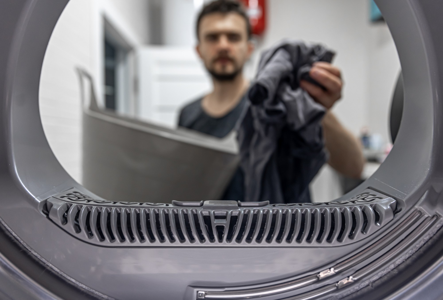 Man Holding Dirty Cloth Hand View Inside Washing Machine